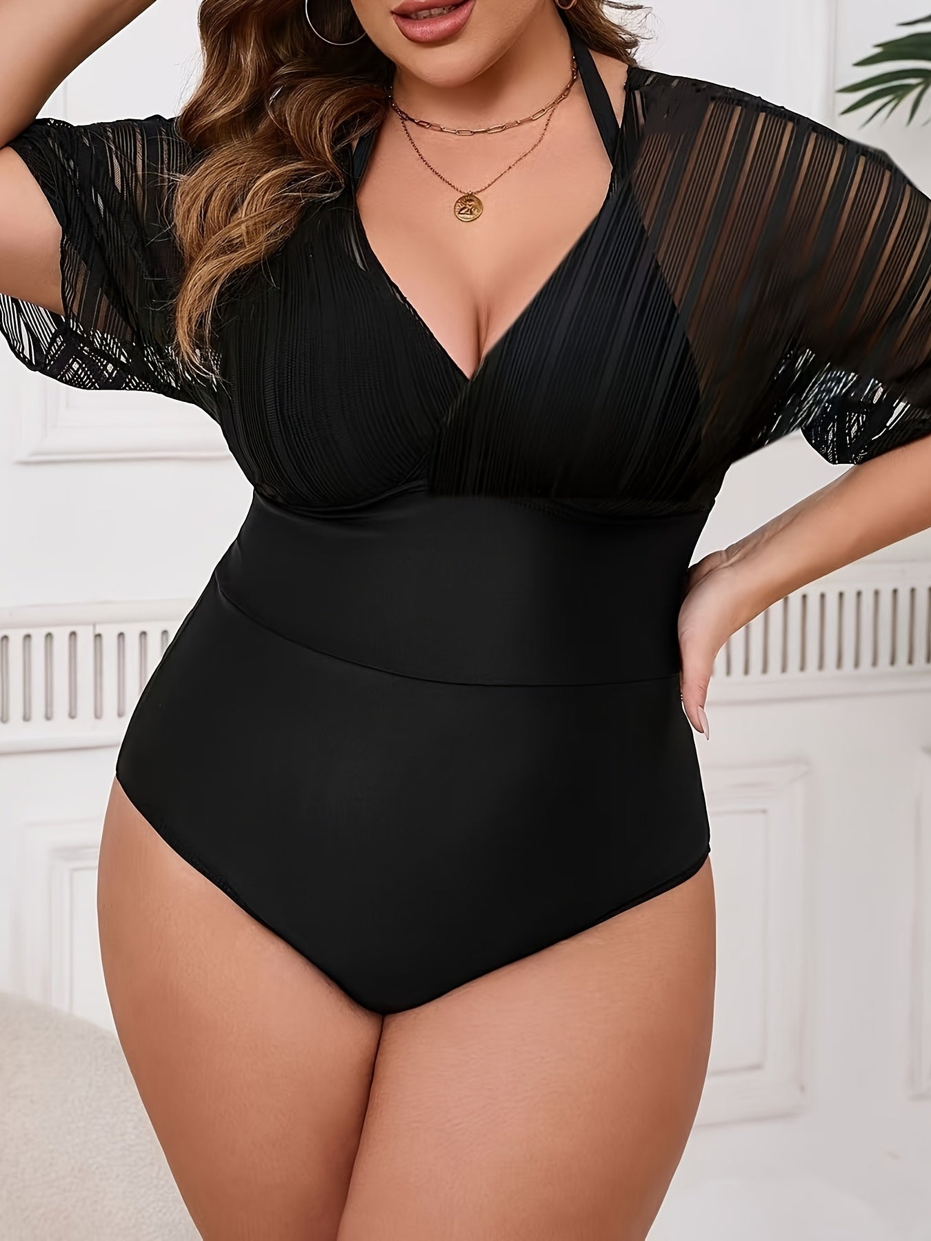 Stylish plus size women's one-piece swimsuit with matching cover-up. Features V-neck, high stretch, removable pads, machine washable.