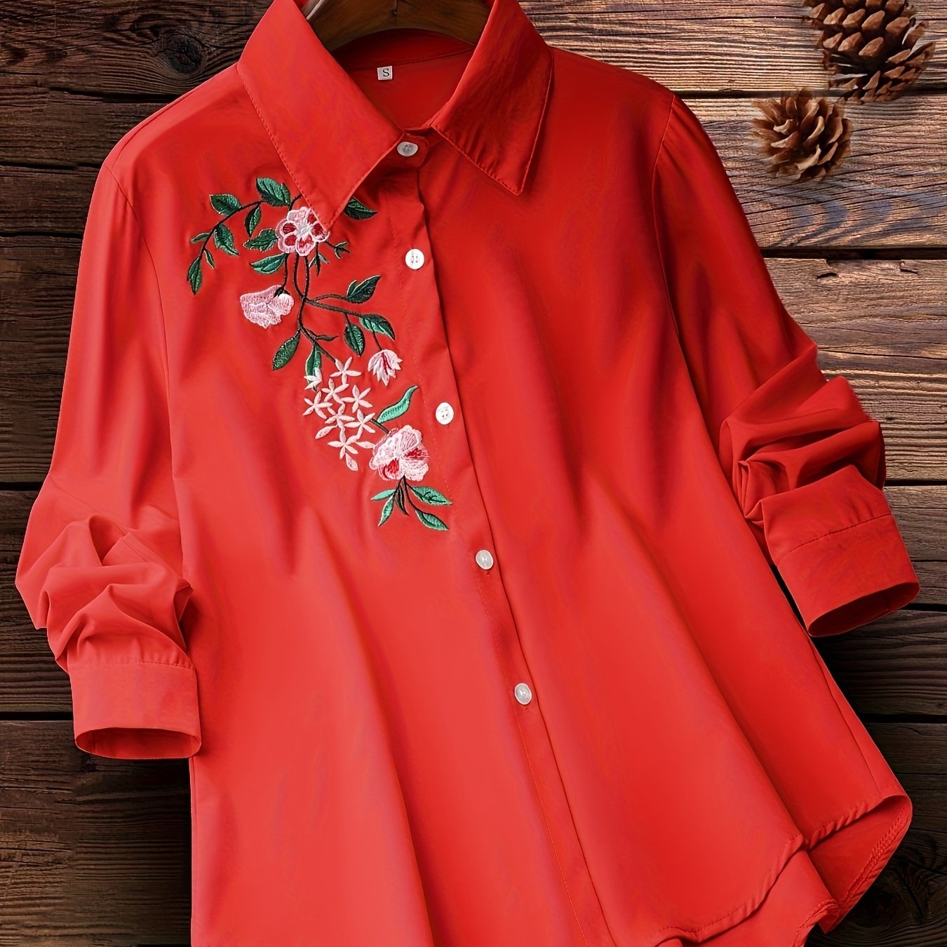 Embroidered floral button-up shirt for women, perfect for spring and fall.