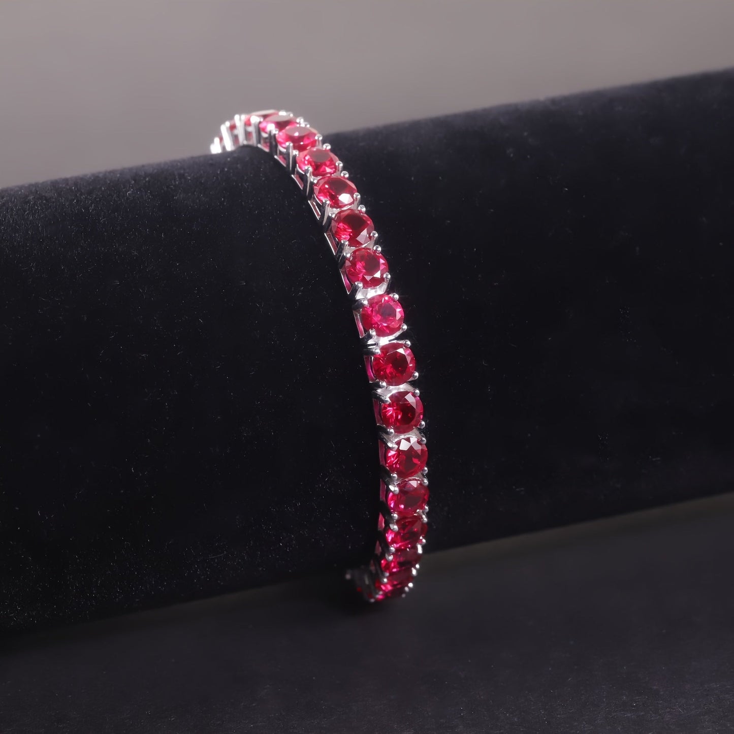 Tennis Bracelet with Synthetic Red Gemstones in Classic Royal Style, made of 925 Sterling Silver and 18K Golden Plated. Features a Flower Theme, perfect for December Birthstone Gift and suitable for Christmas and all Seasons.