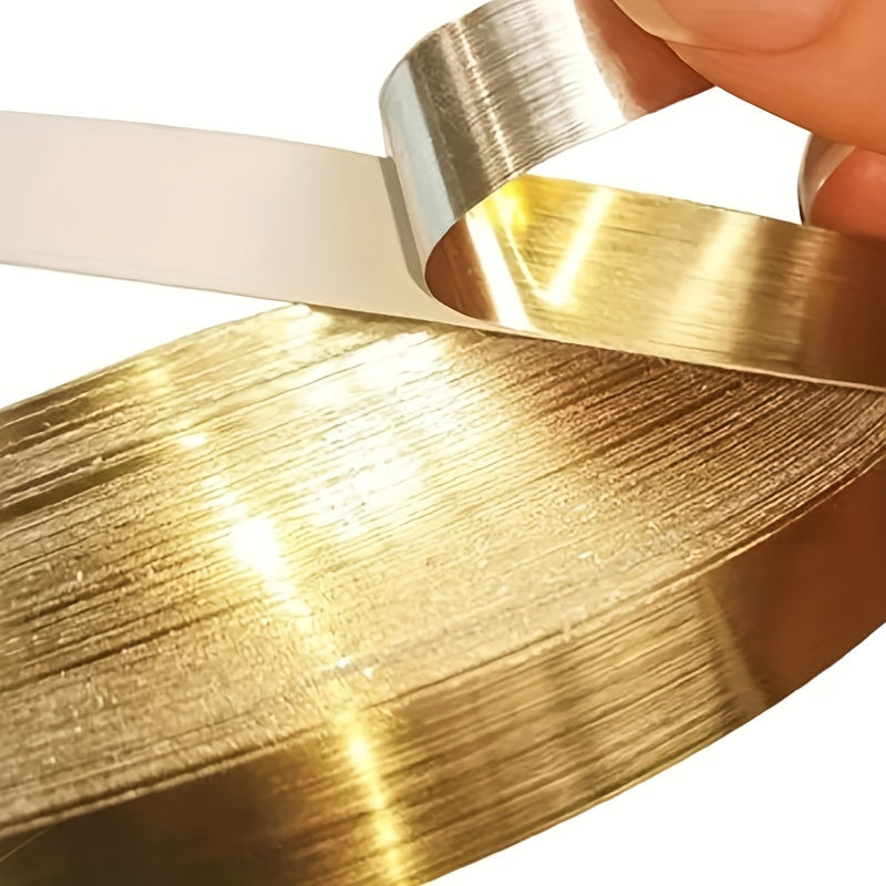 Home décor tape in golden or silver tones, designed to add a decorative touch to wardrobes, walls, floors, tiles, and ceilings. This waterproof, self-adhesive tape fills gaps and seals seams for a polished finish.