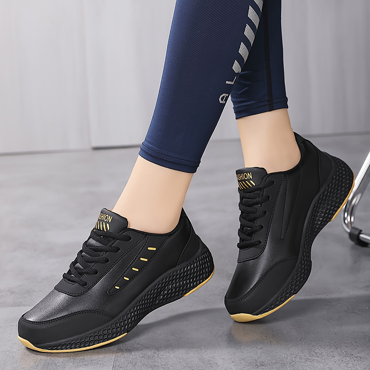 Black platform sneakers for women with lace-up design and comfortable fit, suitable for outdoor activities.