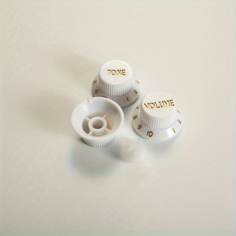 Electric guitar knob cap for volume, tone, and speed control. Available in black, white, or cream yellow.