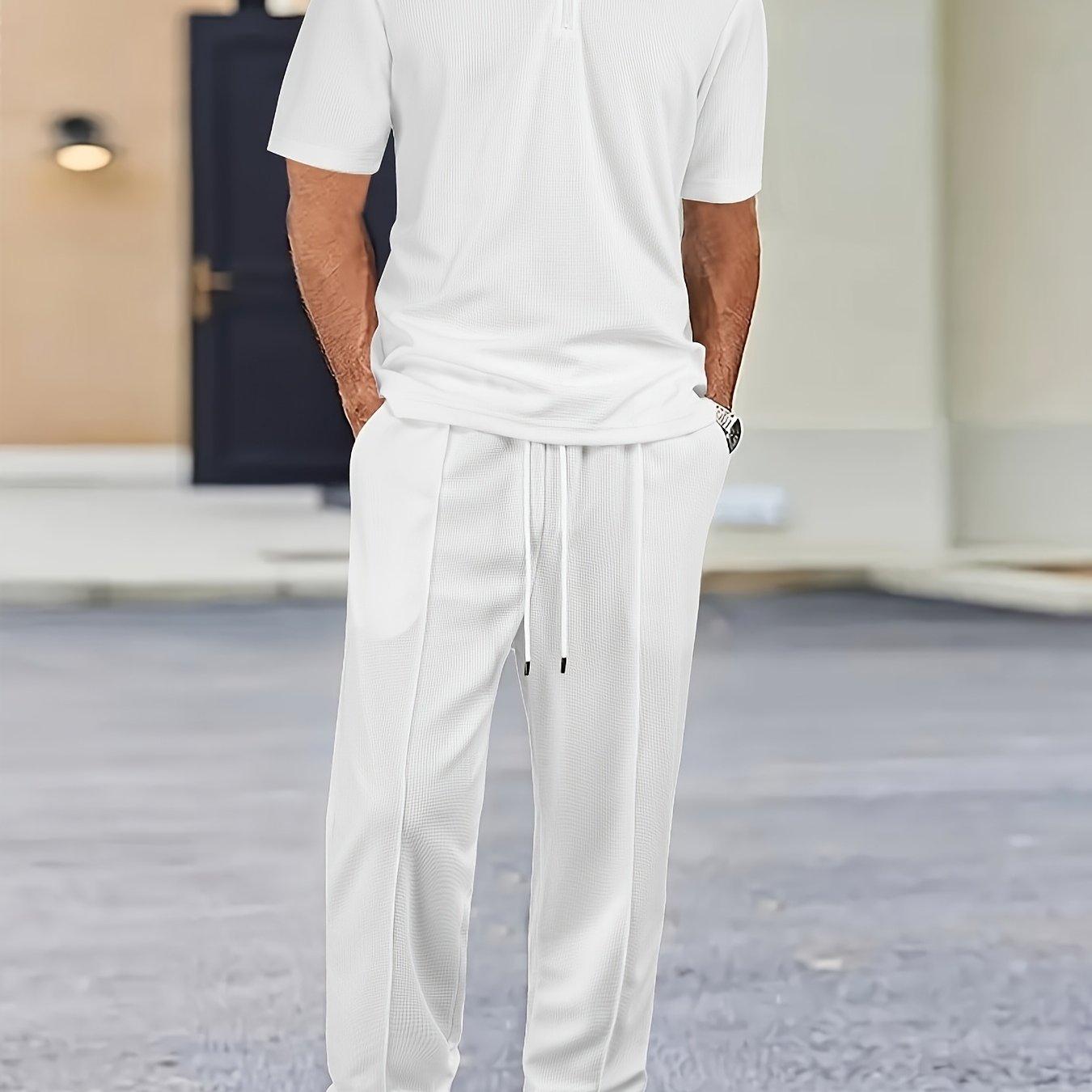 Men's casual outfit with waffle knit short sleeve zip-up shirt and drawstring pants in black. Made of polyester blend, perfect for spring/summer.