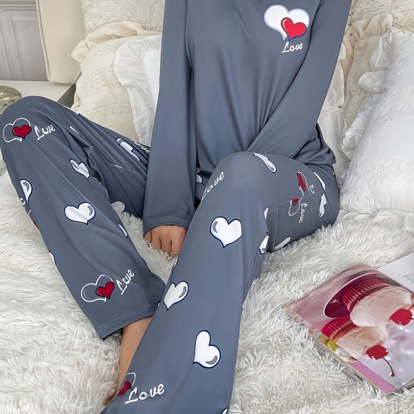 Women's heart print 2-piece pajama set includes long sleeve crew neck top and elastic waist pants in cozy polyester blend for fall/winter.