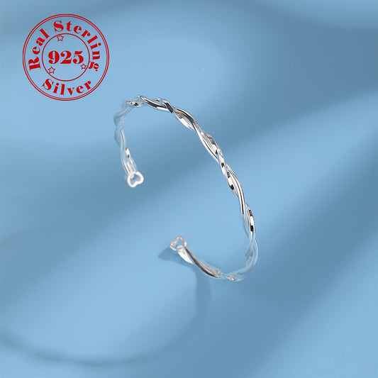 Elegant and simple twisted Möbius band bracelet for women, made of 925 sterling silver with white golden plating. This adjustable open cuff features synthetic zirconia and is hypoallergenic, weighing 9g. Perfect for daily wear or gifting.