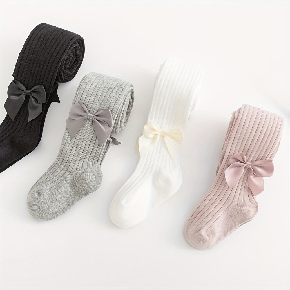 Adorable bow-knot girls' leggings socks in soft ribbed knit, perfect for dance and casual attire. Available in various colors.