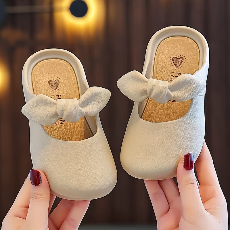 Stylish bowknot slip-on sandals for girls, perfect for indoor and outdoor wear.