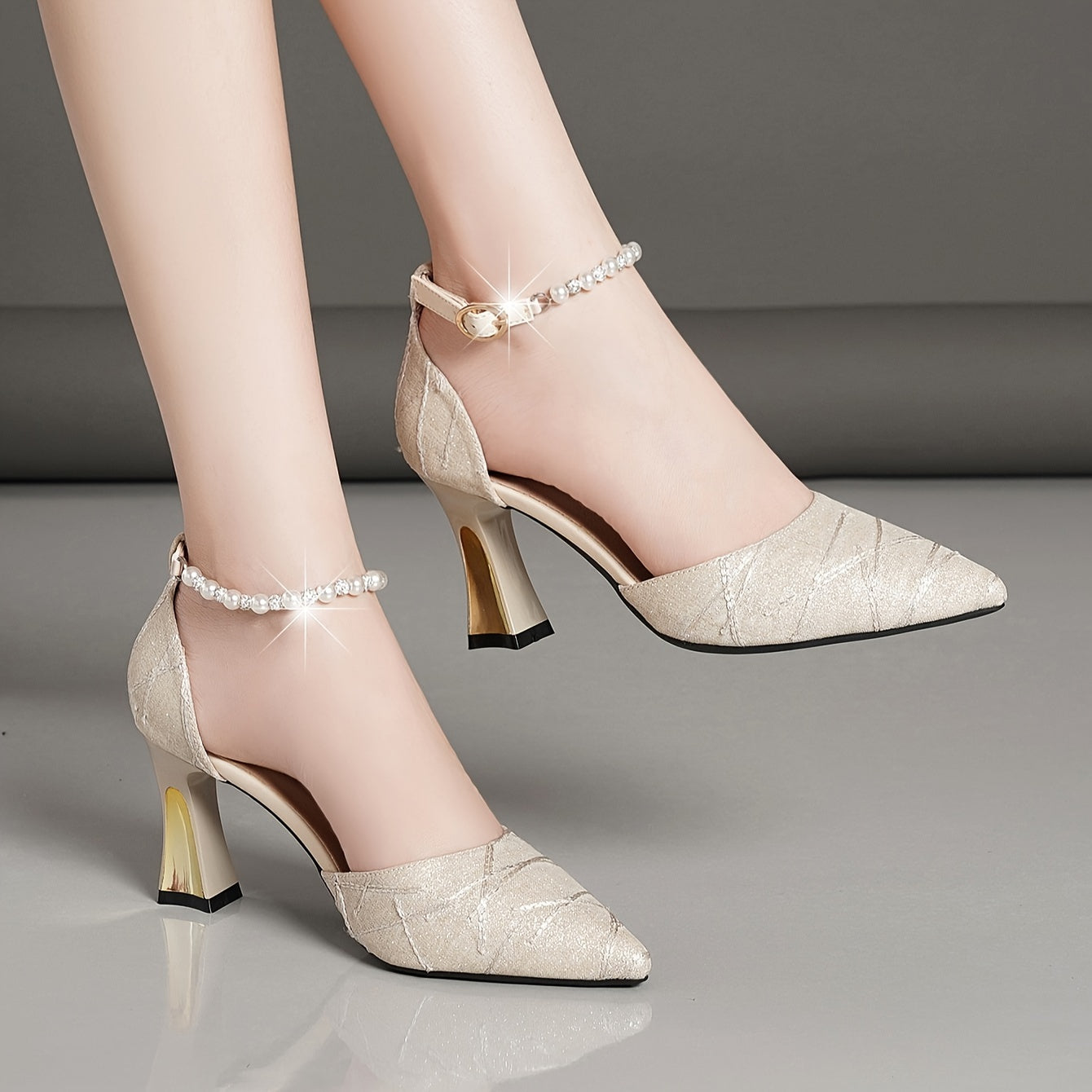 Faux pearl ankle-strap sandals with chunky heel for comfortable and elegant party wear.