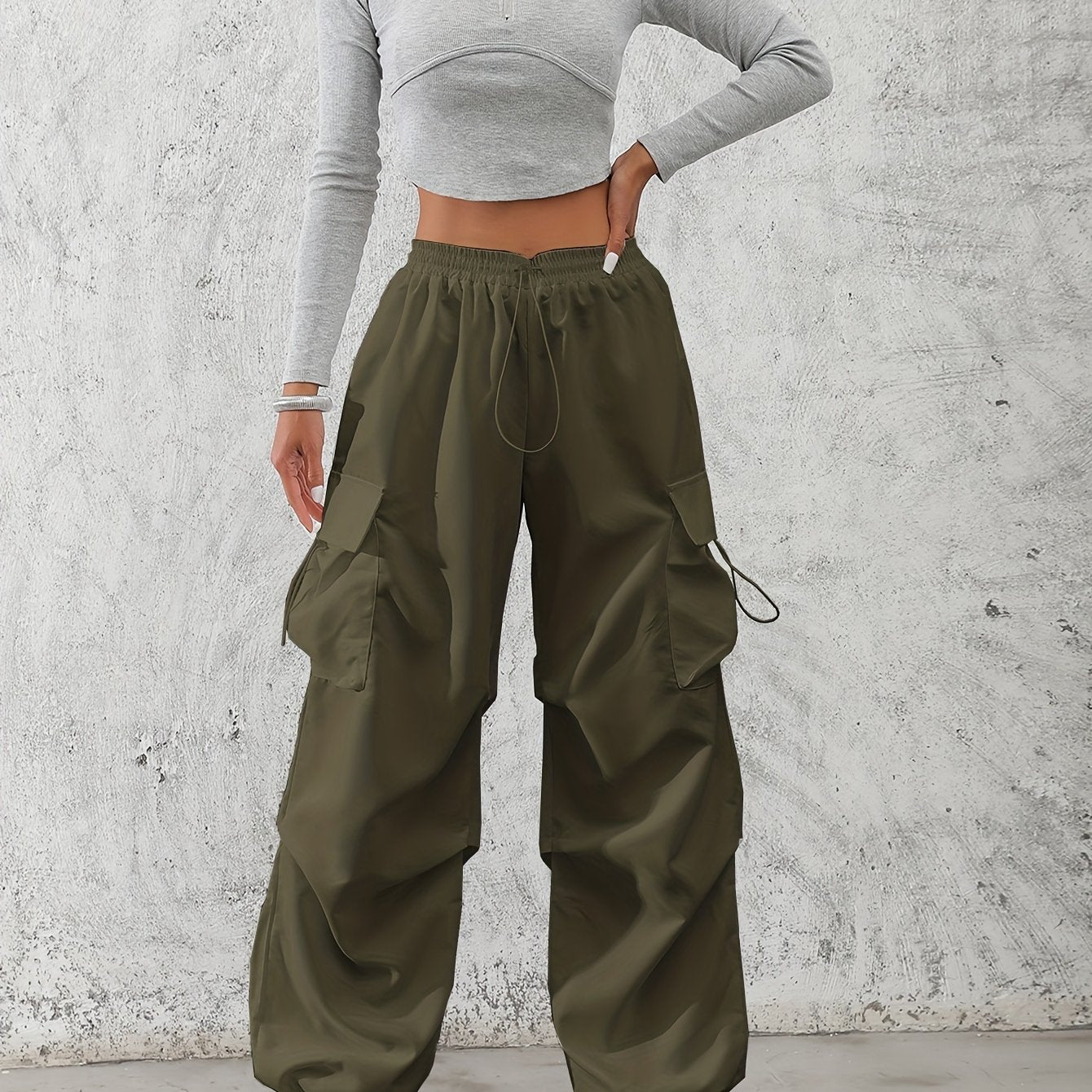 Casual flap pocket cargo pants in solid color for women.