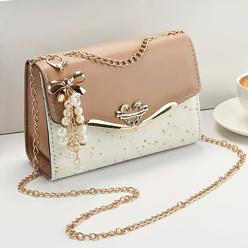 Stylish polka dot PU crossbody bag with tassel charm, magnetic closure, metal chain strap. Ideal for shopping, office, travel. Perfect gift for her.