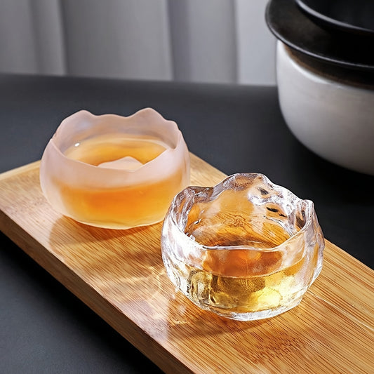 Irregular glass tea cup set with cup mat, perfect for hot drinks and a great gift for the holidays.