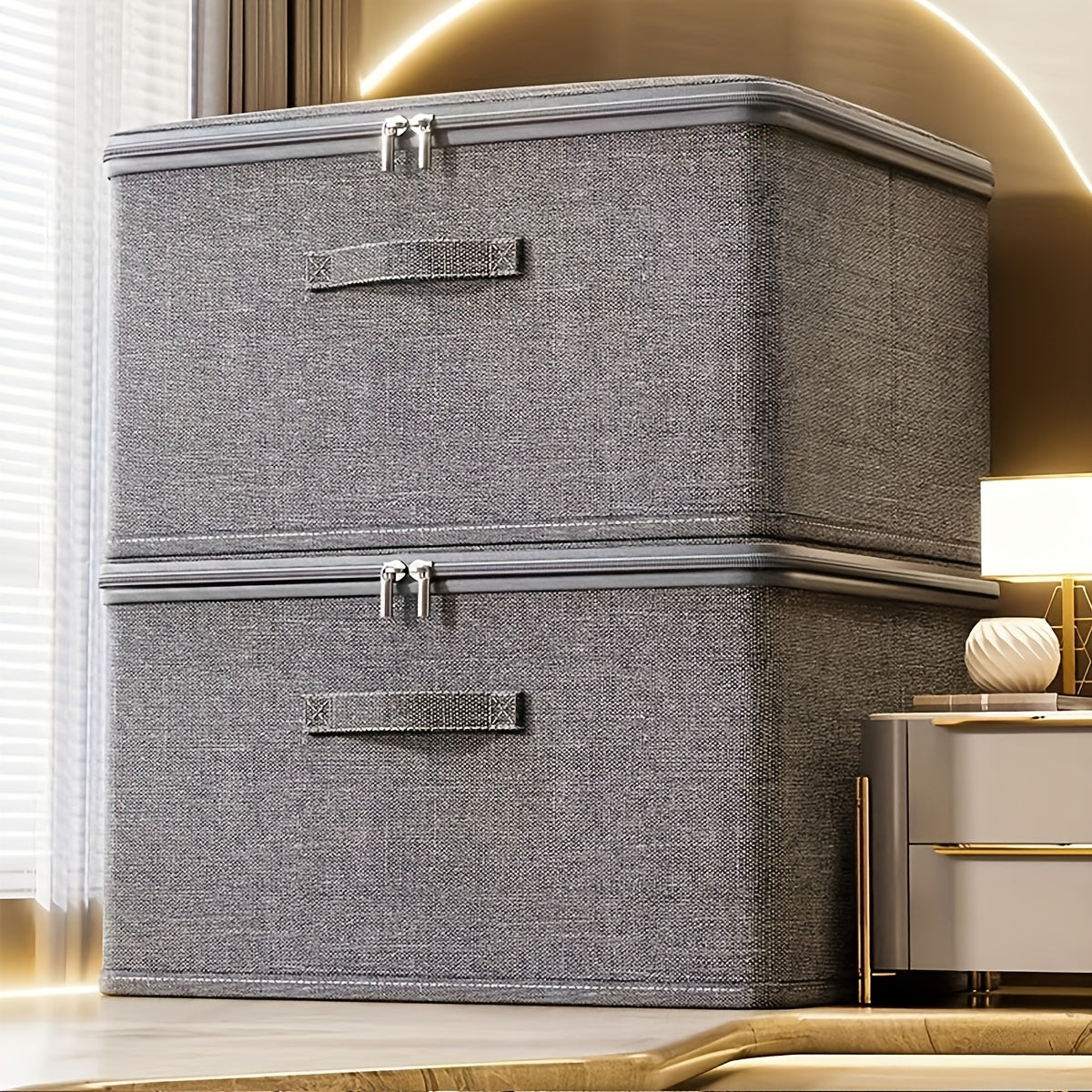 Collapsible storage box with zipper lid and handles, ideal for organizing clothes in the wardrobe.