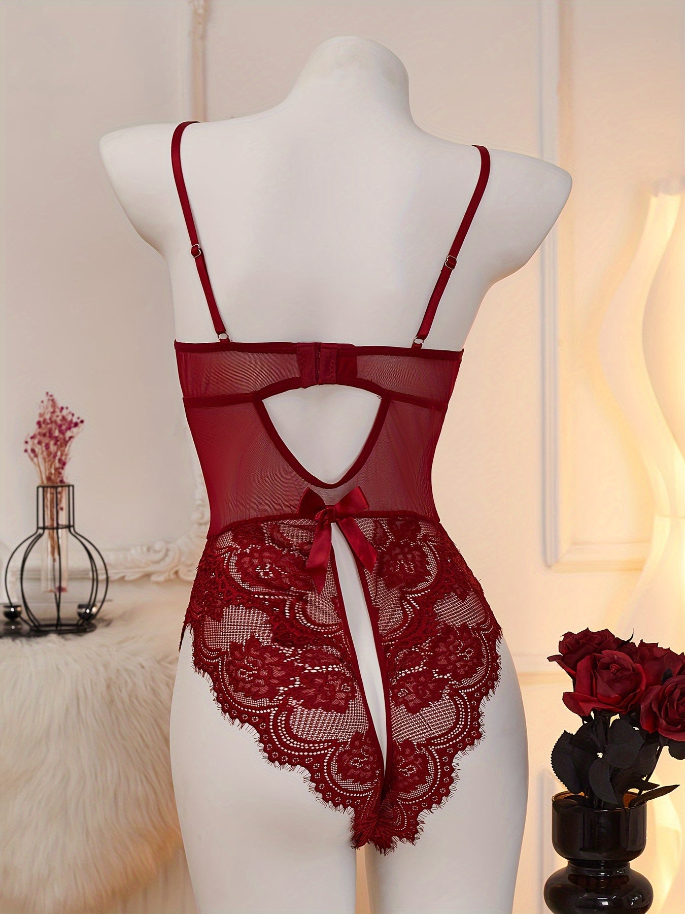 Red lace velvet teddy with heart cut-out, open crotch, and strappy back for women's lingerie.