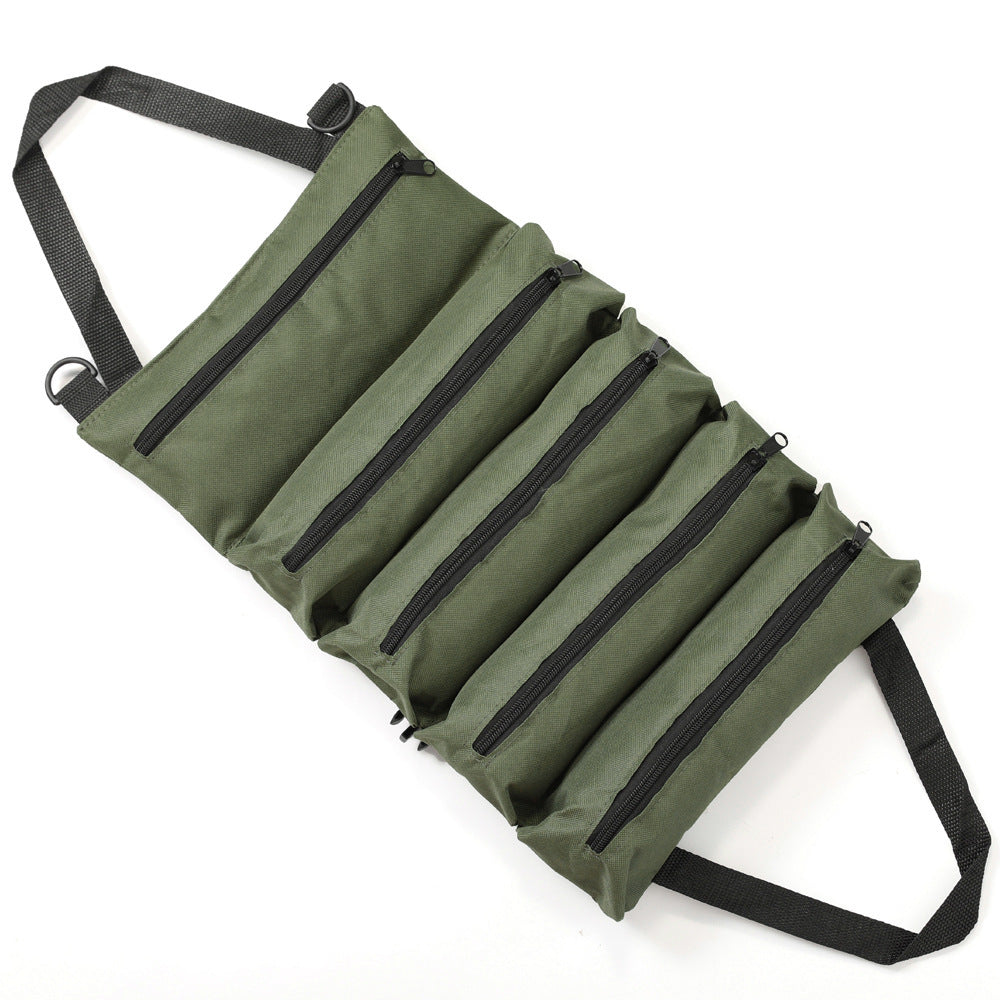 Durable roll-up tool bag for electricians and mechanics with waterproof fabric, multiple compartments, and adjustable shoulder strap in green.