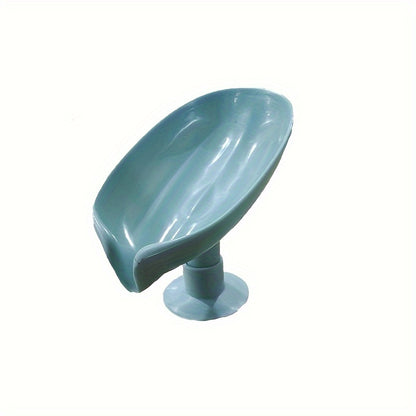 Suction cup soap dish with drainage for home organization and storage, suitable for kitchen and bathroom use.