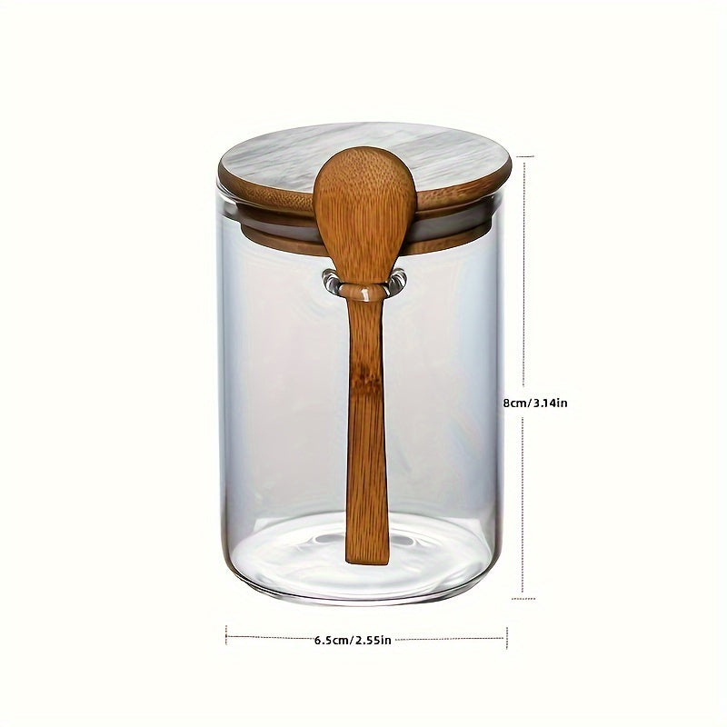 Glass airtight jars with bamboo lids and wooden spoons are versatile round food storage containers for the kitchen. They are reusable, easy to hand wash, and feature a flip top closure. Perfect for storing sugar, spices, and dry goods.