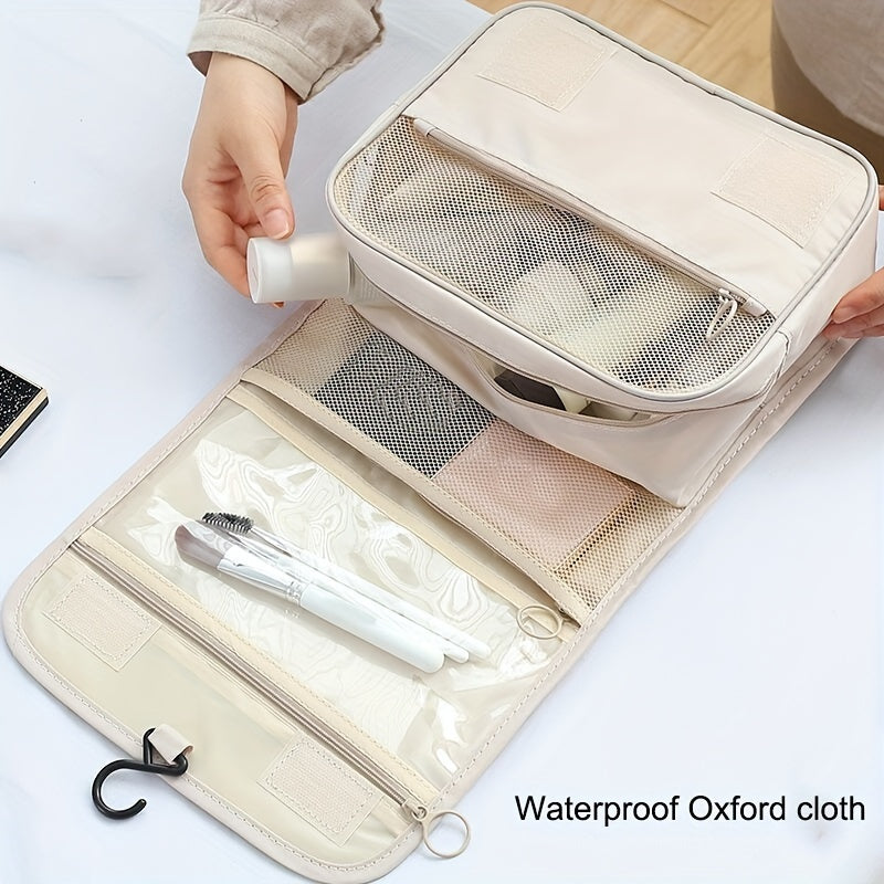 Travel in style with a waterproof Oxford fabric organizer - a versatile folding toiletry bag with a convenient hook for hanging. Available in chic light gray and ivory, this multifunctional bag is perfect for storing cosmetics and other essentials while