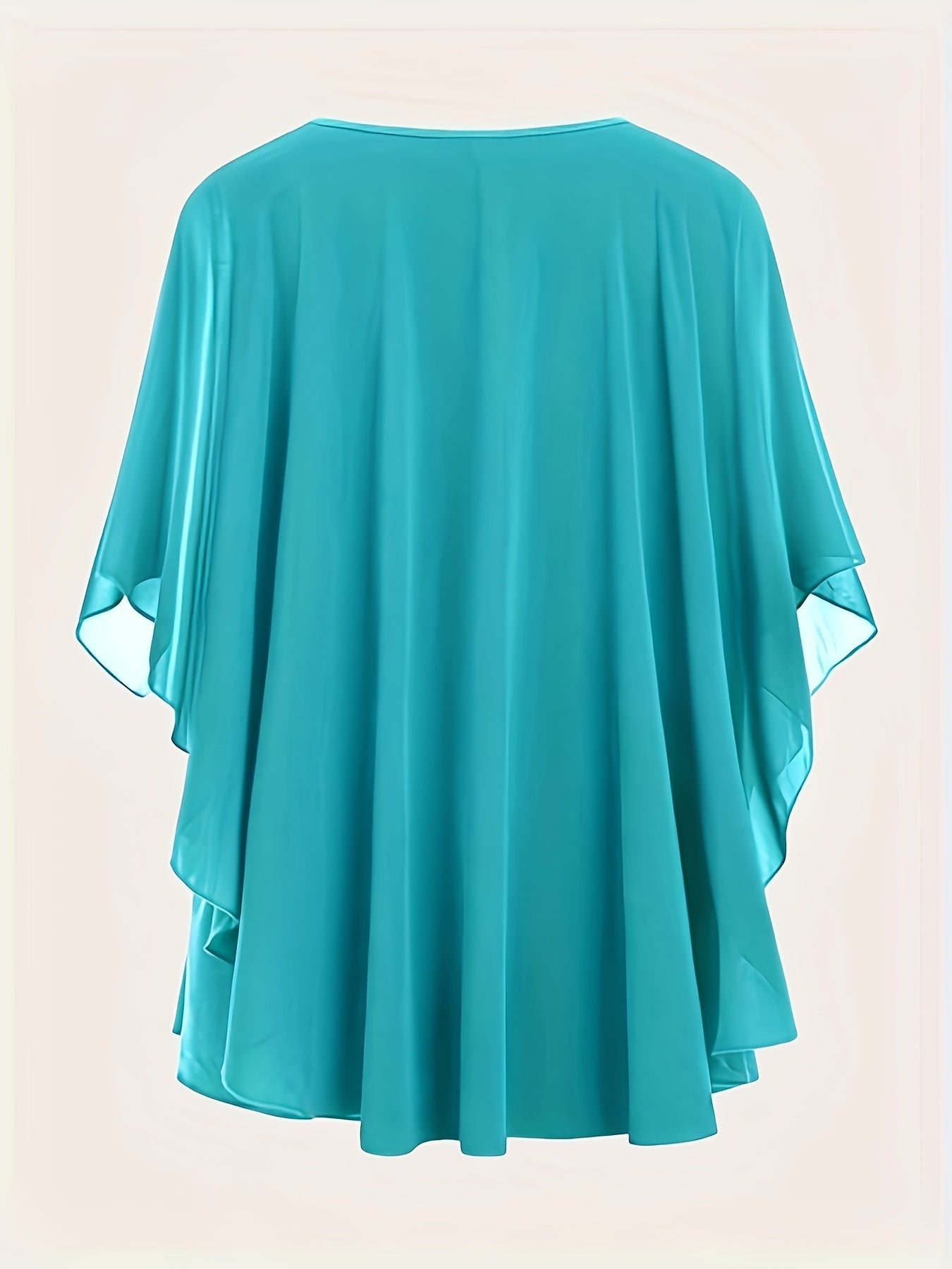 Solid pleated top with crew neck and batwing sleeves, perfect for spring and summer in plus sizes.