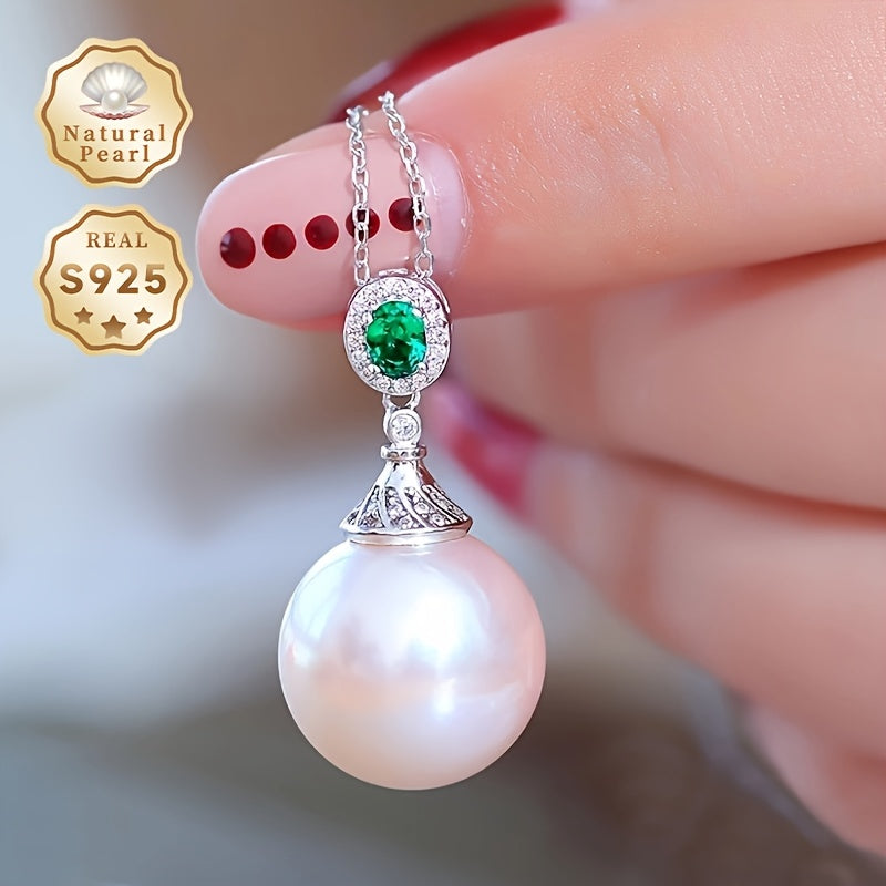 Give your loved one a special treat with this must-have gift box containing a stunning S925 silver pendant necklace featuring a 13-14mm round natural freshwater pearl. Each necklace is unique, with variations in natural pearls, shapes, and colors. The