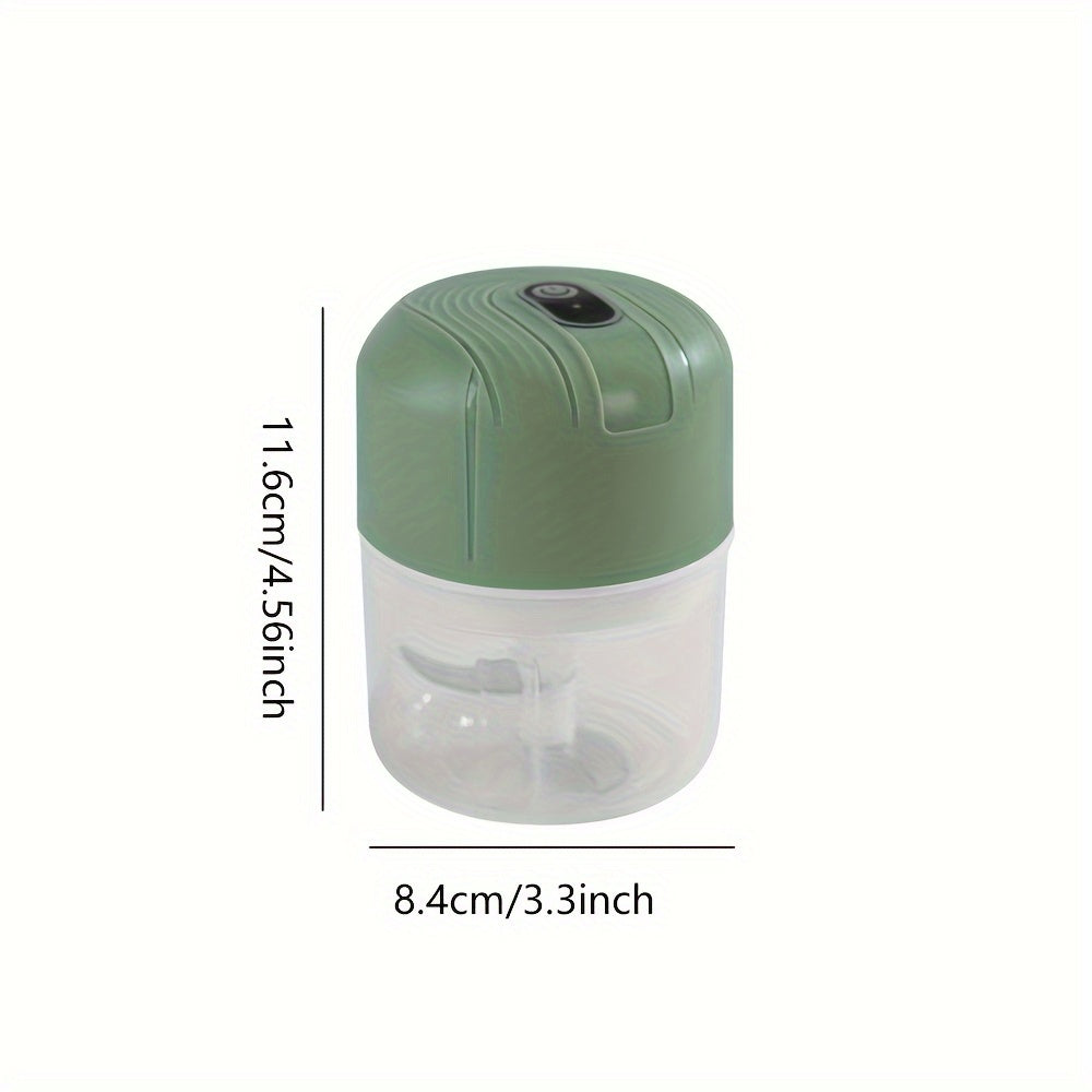 Round plastic container containing a portable multifunctional food chopper that is USB rechargeable. This versatile appliance can be used as a vegetable dicer, garlic masher, manual food processor, and electric mini kitchen appliance with a lithium