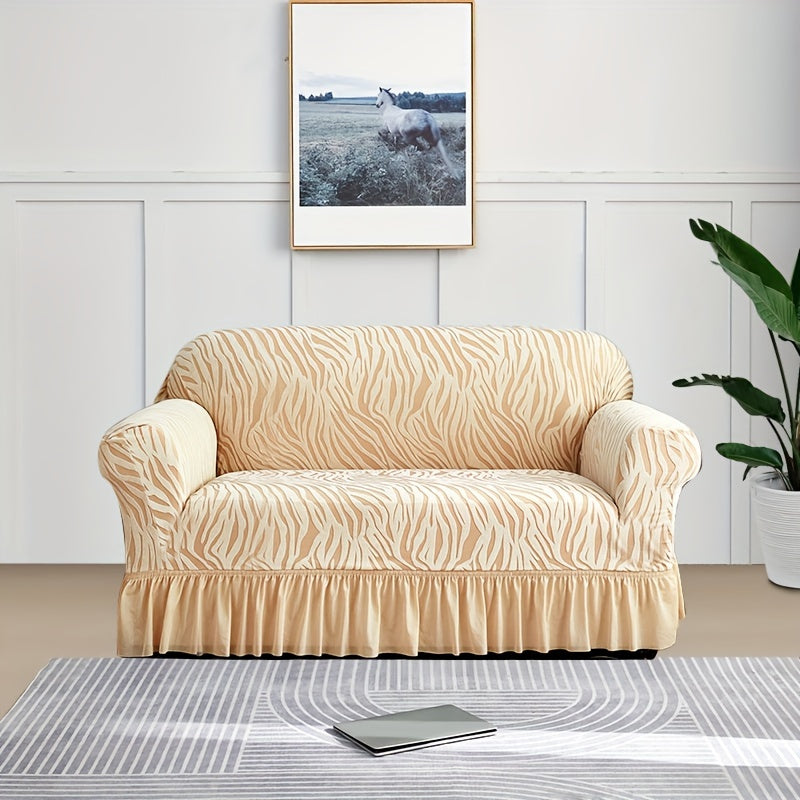 Wave pattern sofa slipcover with skirt, non-slip and dustproof. Protects furniture from cat scratches. Machine washable for easy cleaning. Suitable for bedroom, office, or living room décor.