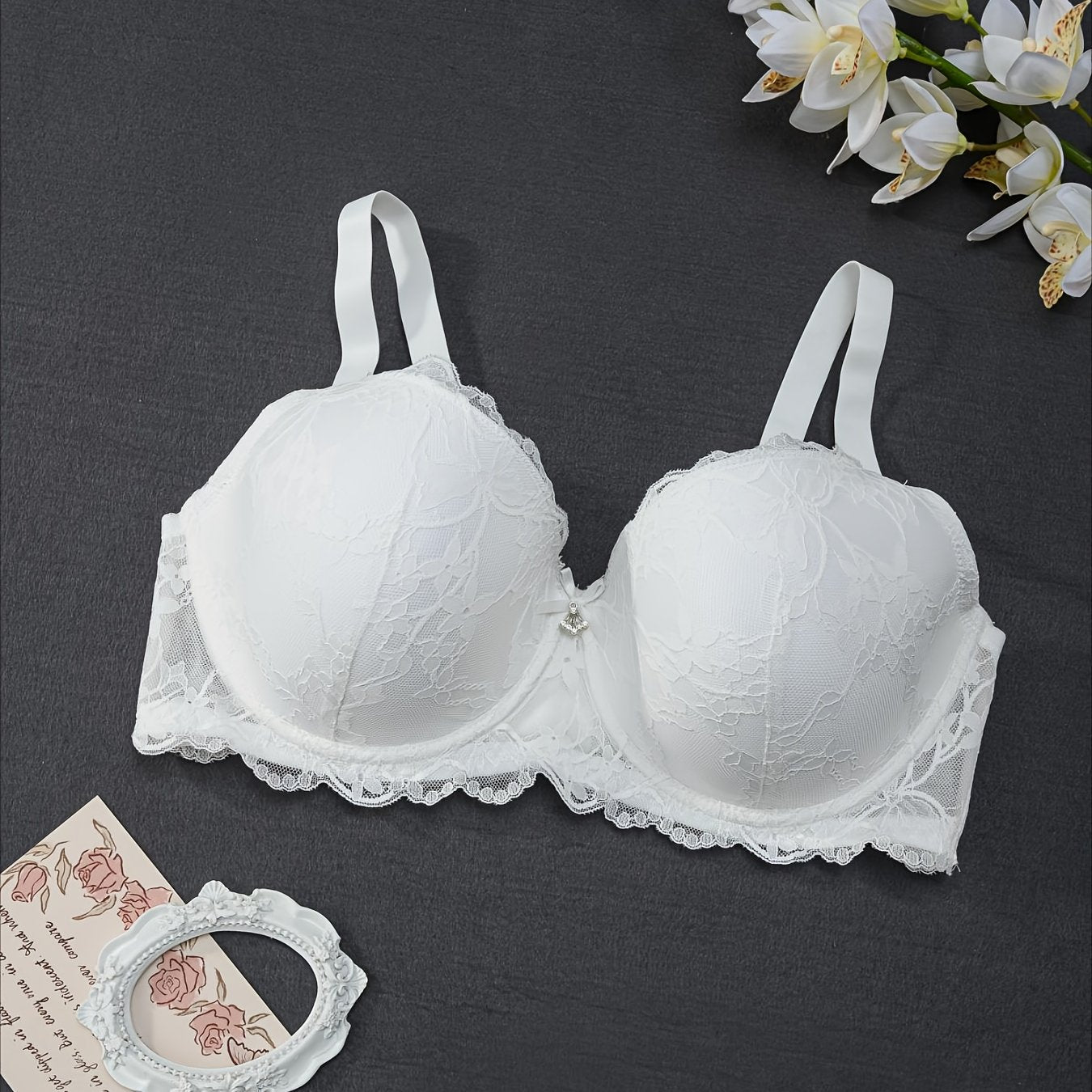 Elegant floral lace underwire bra for plus-size women with bow decor.