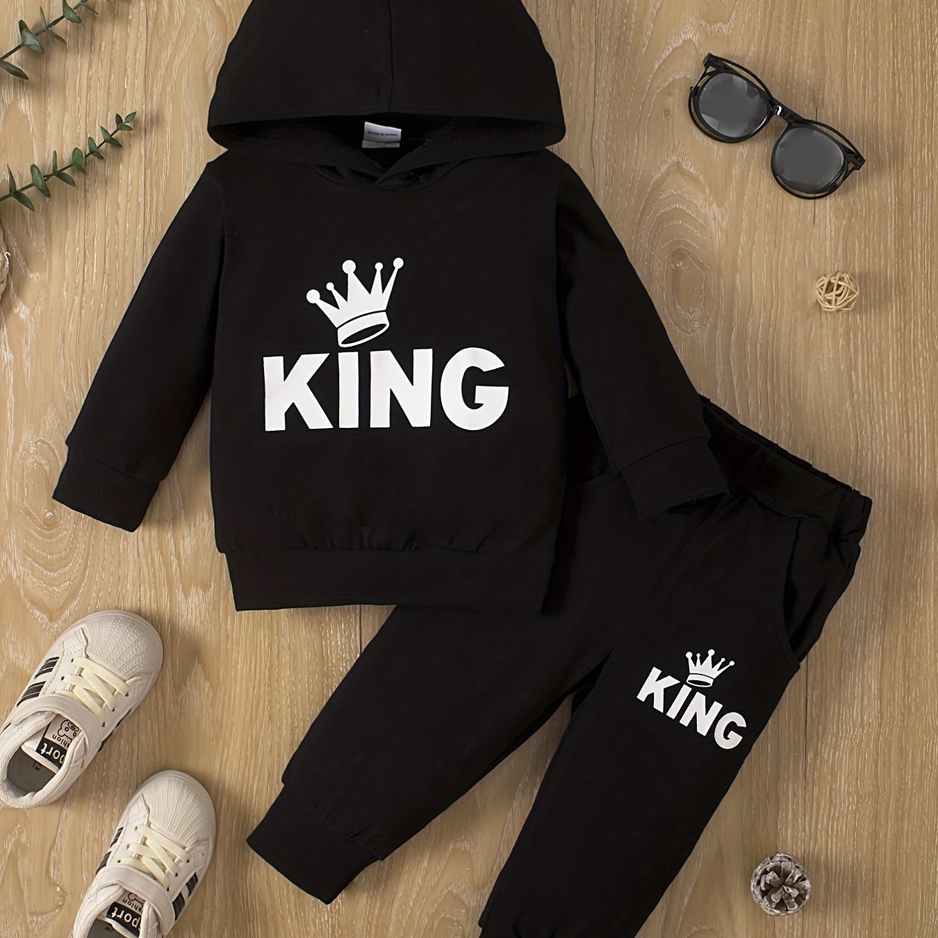 Baby boy's casual outfit set with hooded sweatshirt featuring KING print and matching pants.