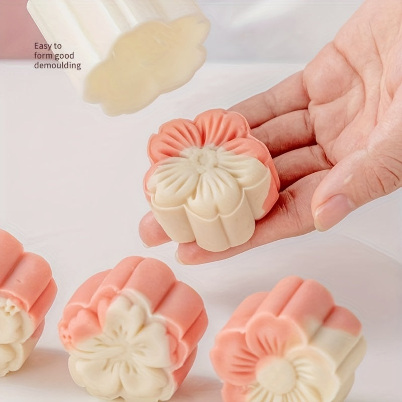 Set of 4 plastic mooncake embossing molds with blossom design for baking and crafting desserts.