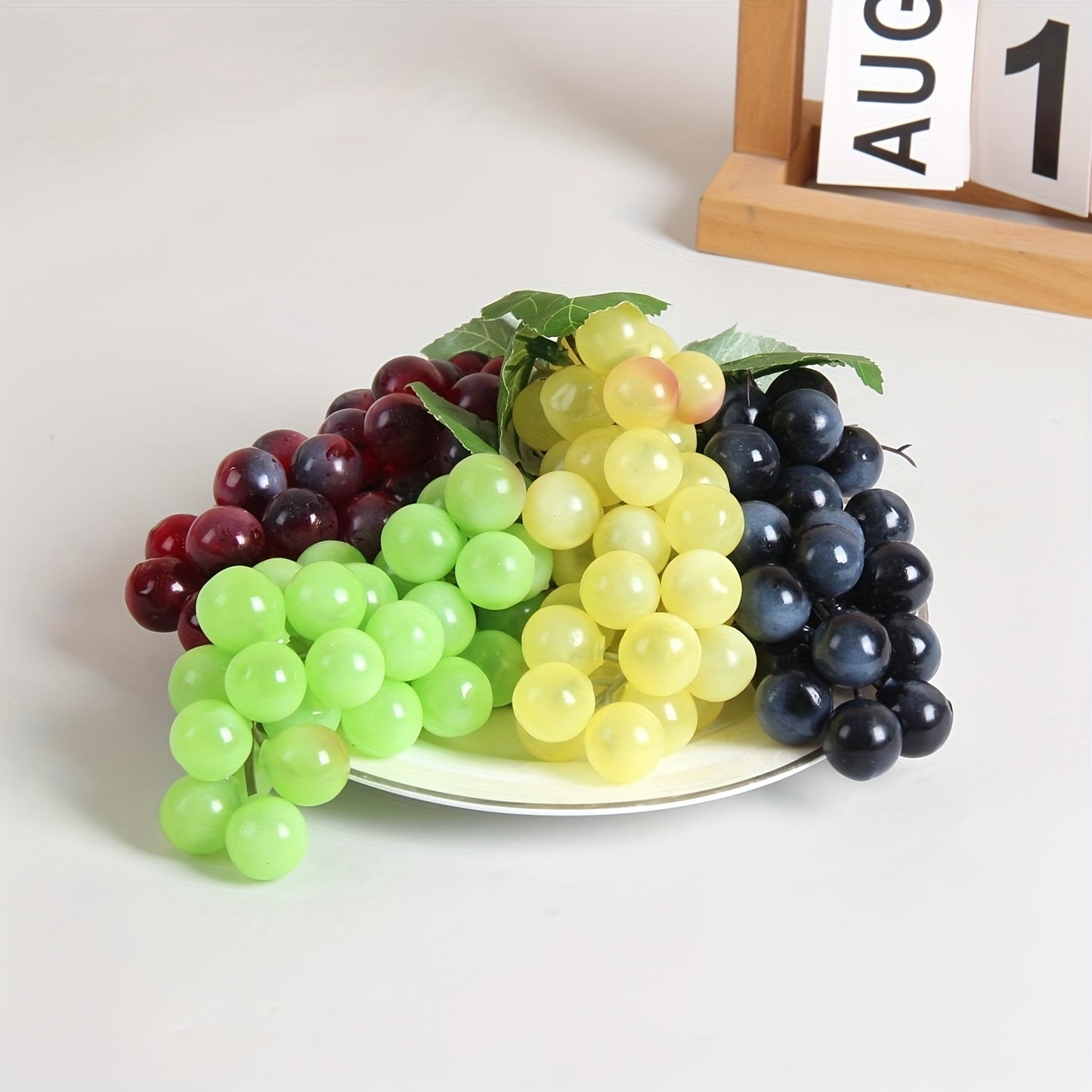 A string of artificial grapes with 36 large beads per string can be hung up for Halloween and Thanksgiving parties, as well as for weddings, kitchen displays, and Christmas gifts.