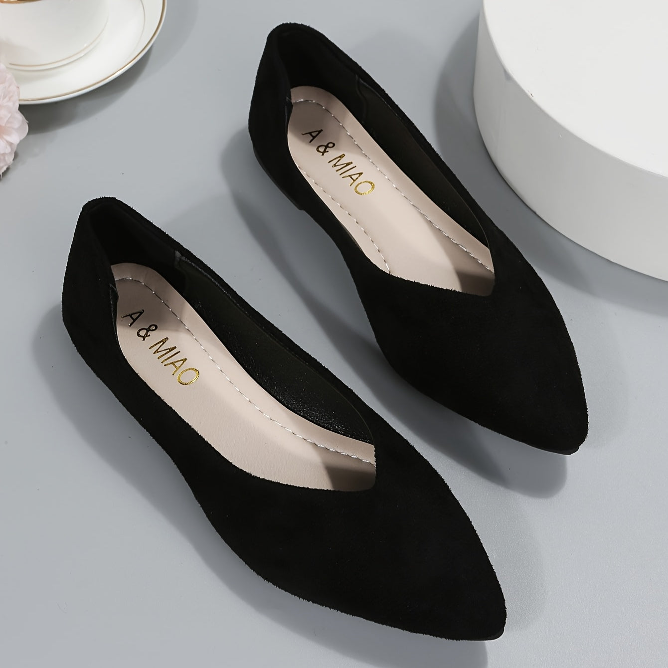 New fashion black point toe flats for plus size women, suitable for daily wear with lightweight and comfortable design.