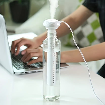 Compact USB-powered cool mist humidifier, perfect for travel, office, hotel, car, and home. No need for a water bottle, simple to use with a soakable swab.