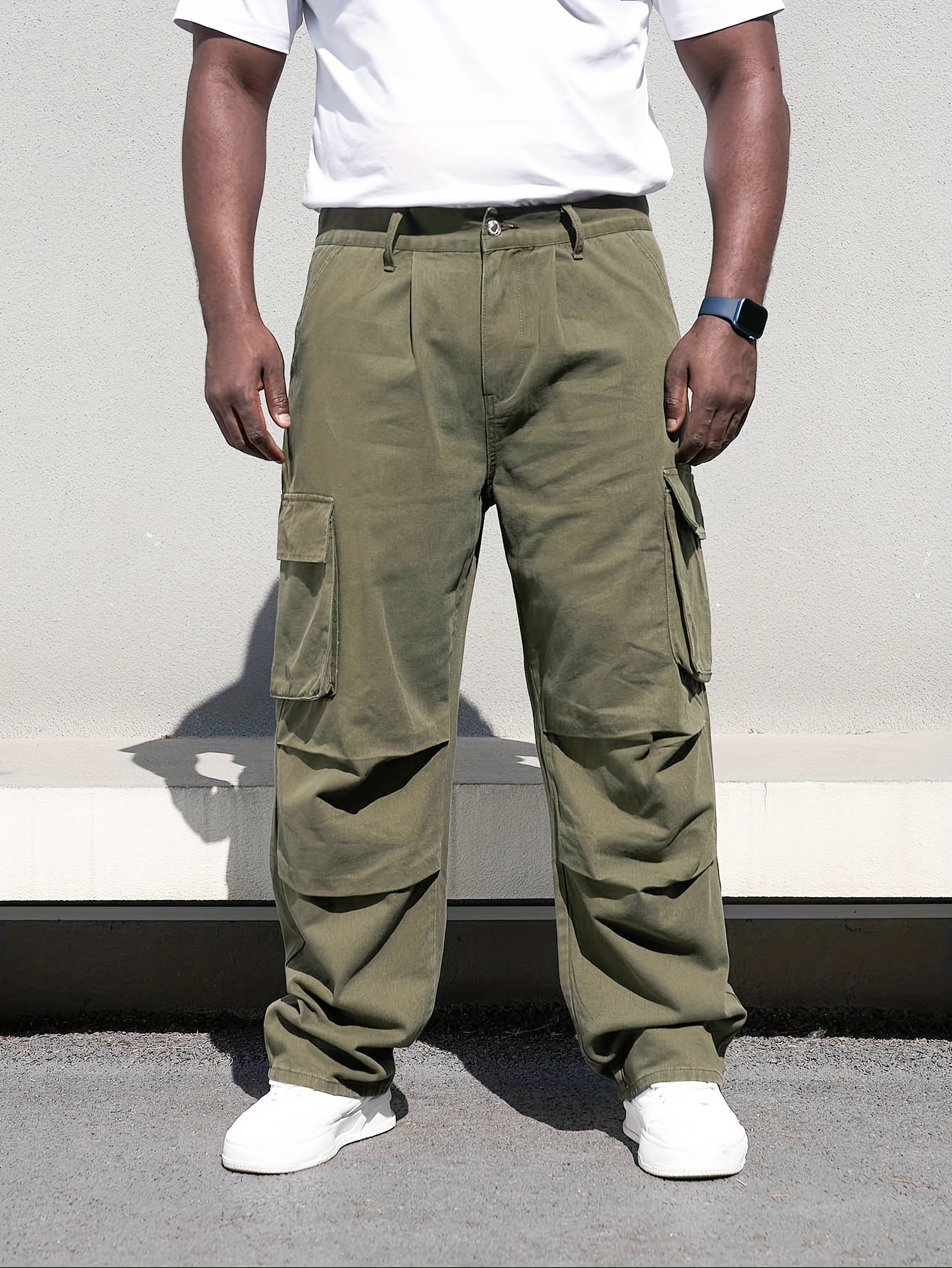 Men's plus size casual denim trousers with loose fit, cotton cargo pants featuring multiple pockets for a trendy look.