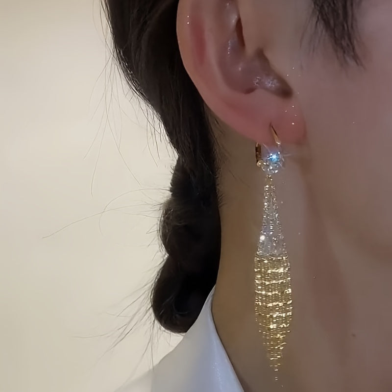 Elegant tassel earrings with sparkling zirconia, perfect for everyday wear or special occasions. Add a touch of glamour to your casual outfits or date night look.