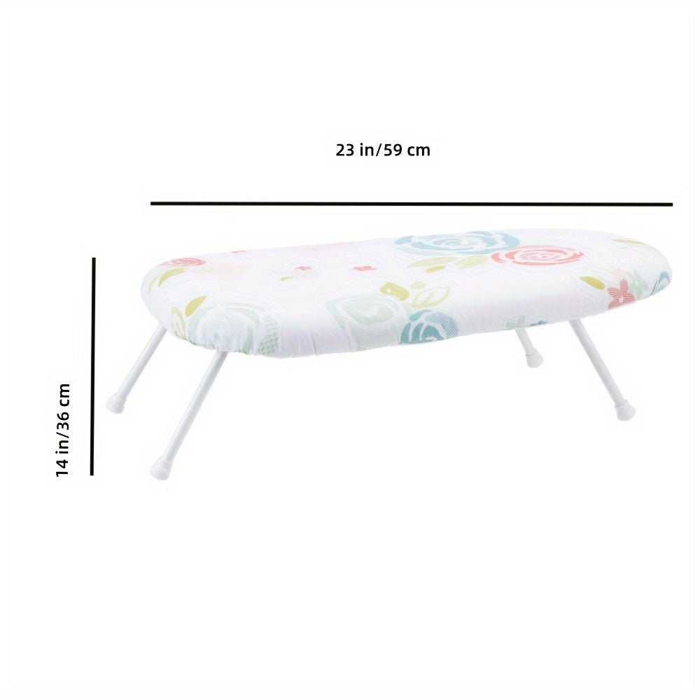 This foldable ironing board features a floral pattern design and is made of thick, high-temperature resistant material. It has a space-saving design with a hanging option, and comes in white with colorful flowers. Measuring 58.42cm x 35.56cm, this