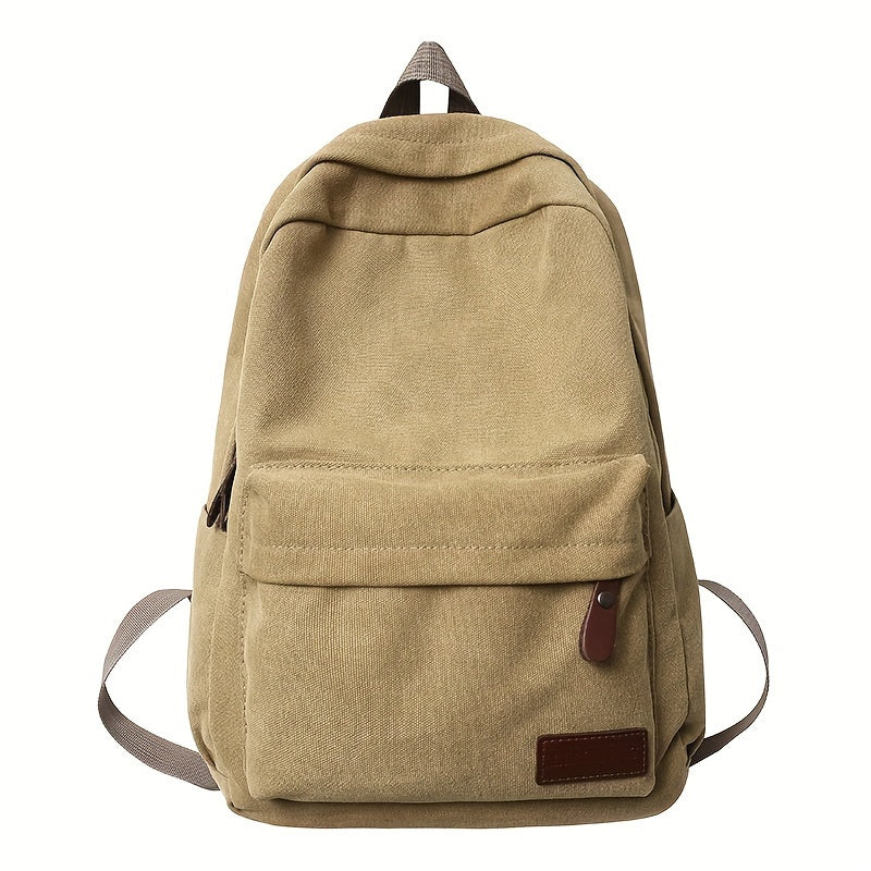 Sturdy canvas backpack with adjustable straps, perfect for school, travel, and work, fits 15-inch laptop.