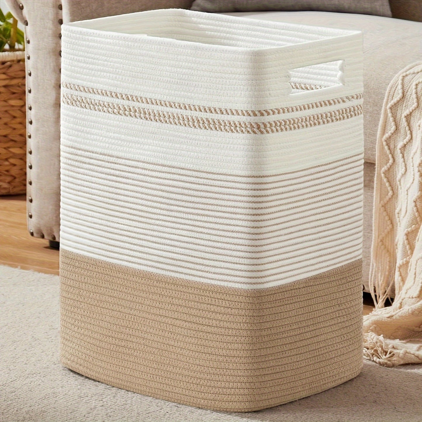 This large cotton rope laundry basket with handles is perfect for storing clothes and blankets in style. It's ideal for organizing your living room or bedroom and is suitable for ages 14 and up. Made of durable cotton material, this decorative woven