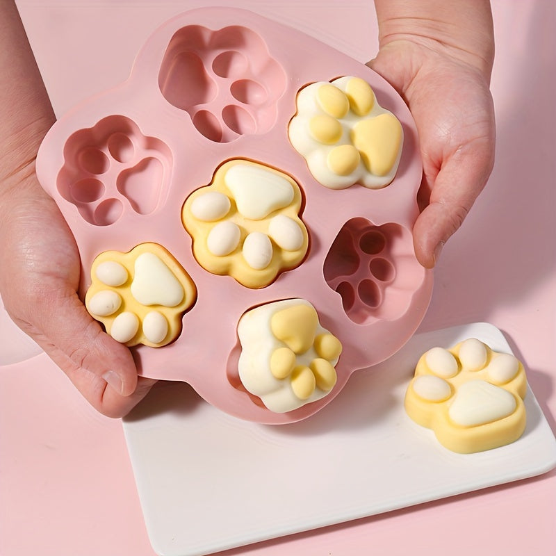 Pink Silicone Paw Print Treat Mold with 7 cavities - non-stick, food-grade silicone for baking a variety of treats including dog treats, cookies, candy, chocolate, and jelly. Perfect for baking with silicone molds.