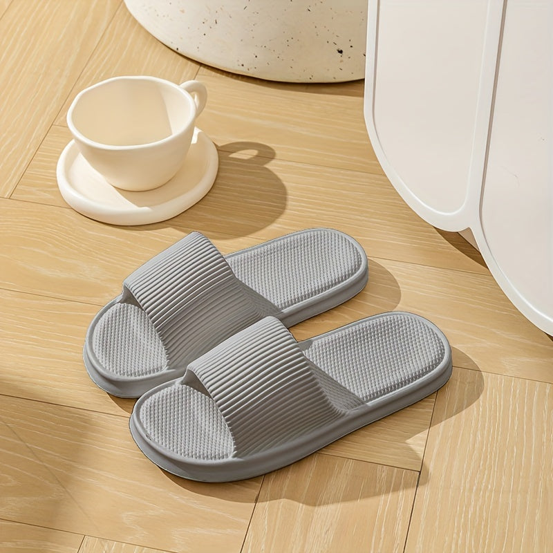 Gender-neutral EVA pillow slides with solid color, lightweight soft sole for home and beach comfort.