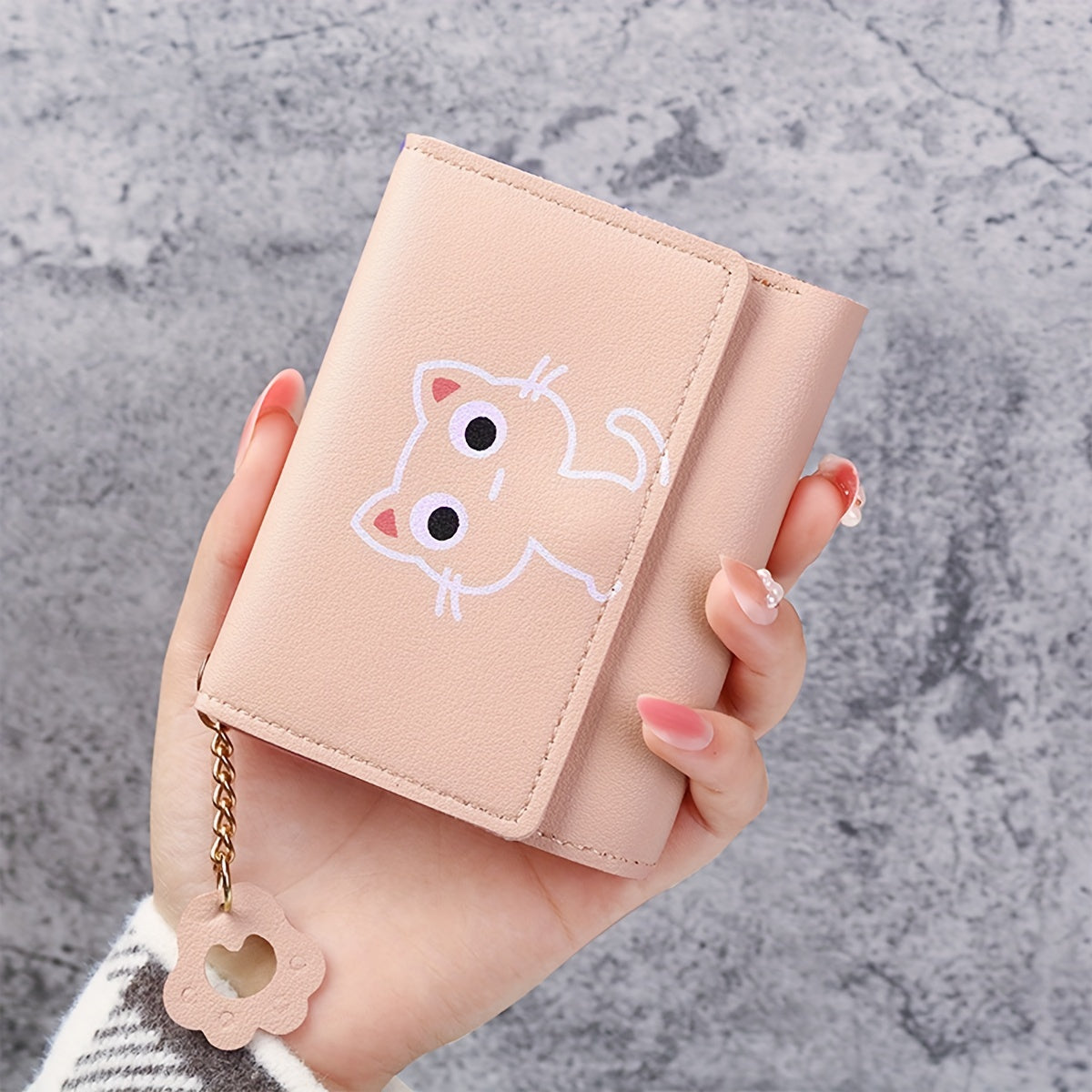 1 Cute Cat Cartoon Mini Wallet for Women made of pink faux leather, features a short tri-fold design with key ring and heart charm. Ideal for daily use and as a gift for cat lovers.