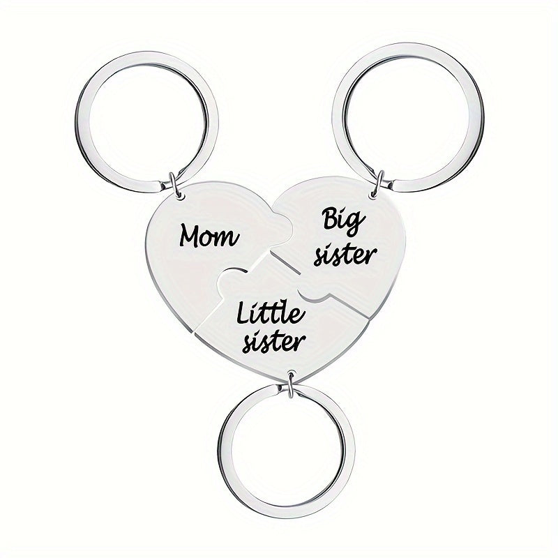 Set of three heart-shaped keychains for mothers and daughters, engraved with "Mom," "Big Sister," and "Little Sister." This matching pendant accessory set symbolizes family connection.