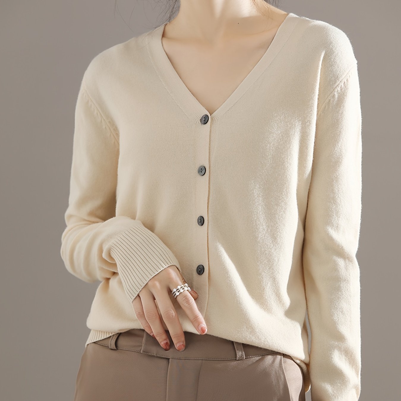 Chic V-neck cardigan with long sleeves, perfect for spring and fall.