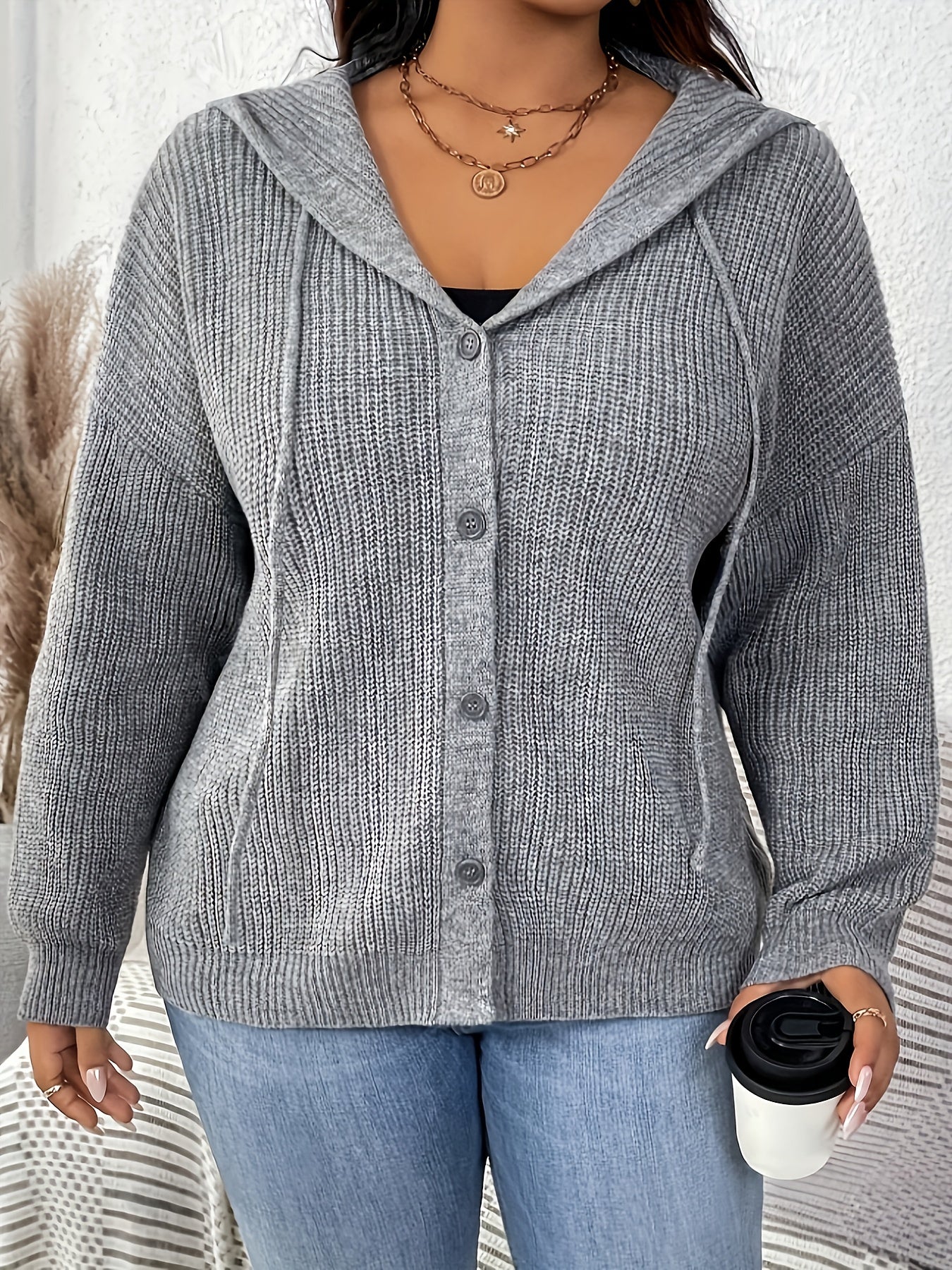 Gray cardigan with hood and drawstring detail, ideal for fall/winter wardrobe.