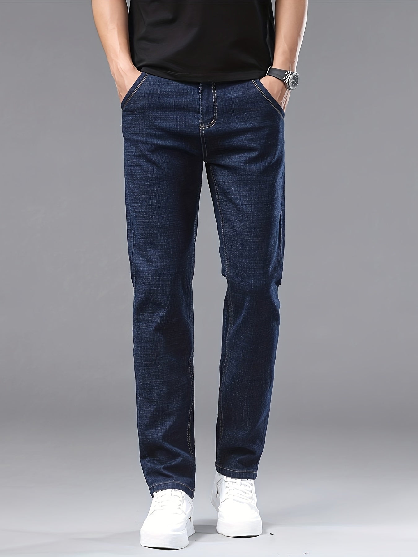 Men's slim-fit jeans made of 61.6% cotton, 36.9% polyester, and 1.5% spandex with all-season stretch denim. Raw wash in a solid color, regular fit for casual weekends. 200gsm woven fabric.