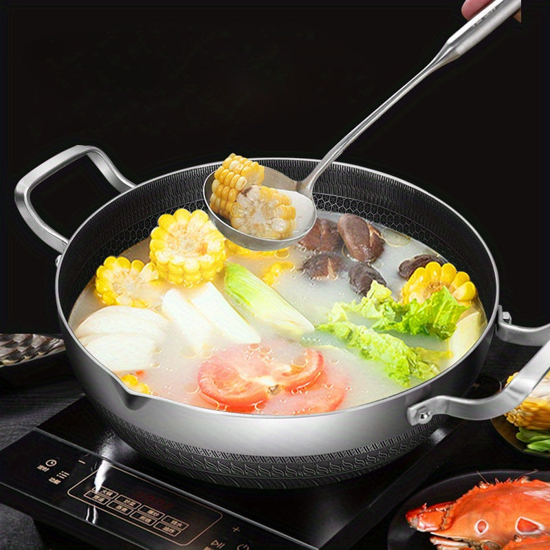 The 10-inch stainless steel frying pan comes with a lid and features a honeycomb non-stick bottom. It is induction compatible and has dual handles, making it versatile for use in various cooking methods such as hot pot and frying.