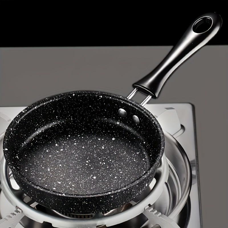 Mini non-stick frying pan, built to last with durable design. Perfect for cooking eggs and vegetables on the go, this portable skillet features a flat bottom for even heat distribution. Easy to clean and maintain, this cookware is thickened and designed