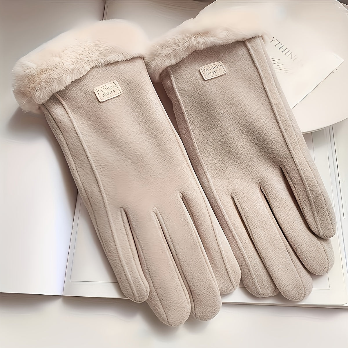 Stay warm and stylish with these cozy women's beige touchscreen gloves. Made with thick warm plush lining and full finger design, these winter gloves are crafted with knitted polyester material for ultimate comfort. The inelastic fit provides a snug