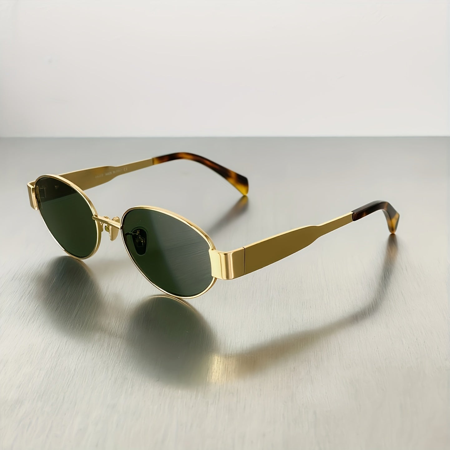 Vintage metal oval-framed glasses for men and women, designer holiday must-haves.