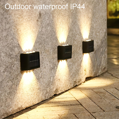 2 solar LED lights for outdoor decoration, easy to install on garden walls.