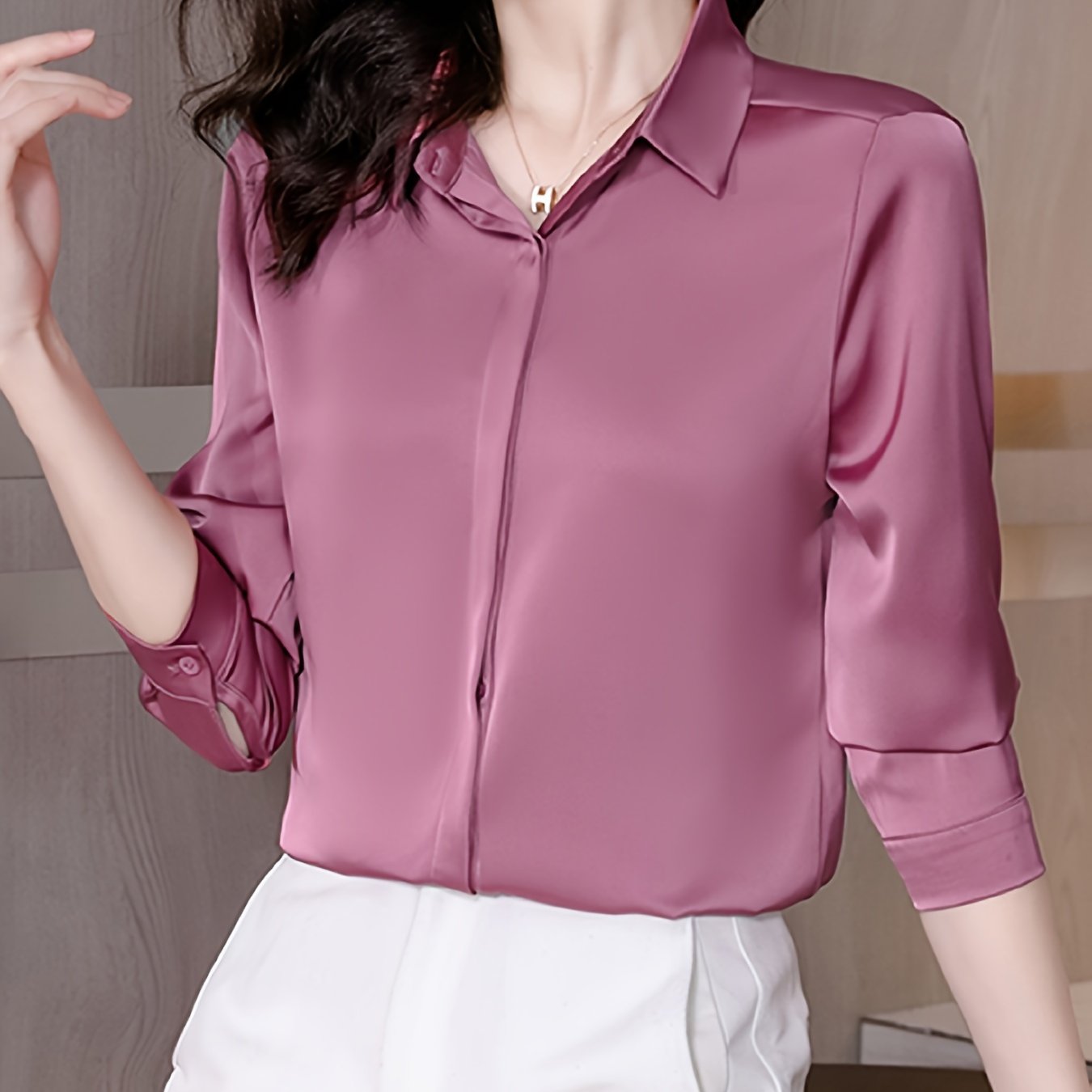 Long sleeve satin shirt with solid color, collared button-up design for women. Machine washable and perfect for spring/fall. Ideal for sophisticated adults with luxurious style.