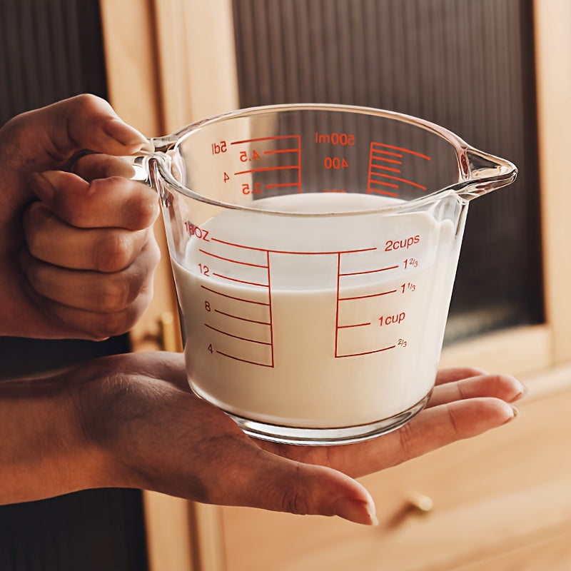 500ml heat-resistant glass measuring cup: precise scale, ergonomic handle, microwave/oven safe for baking/cooking.